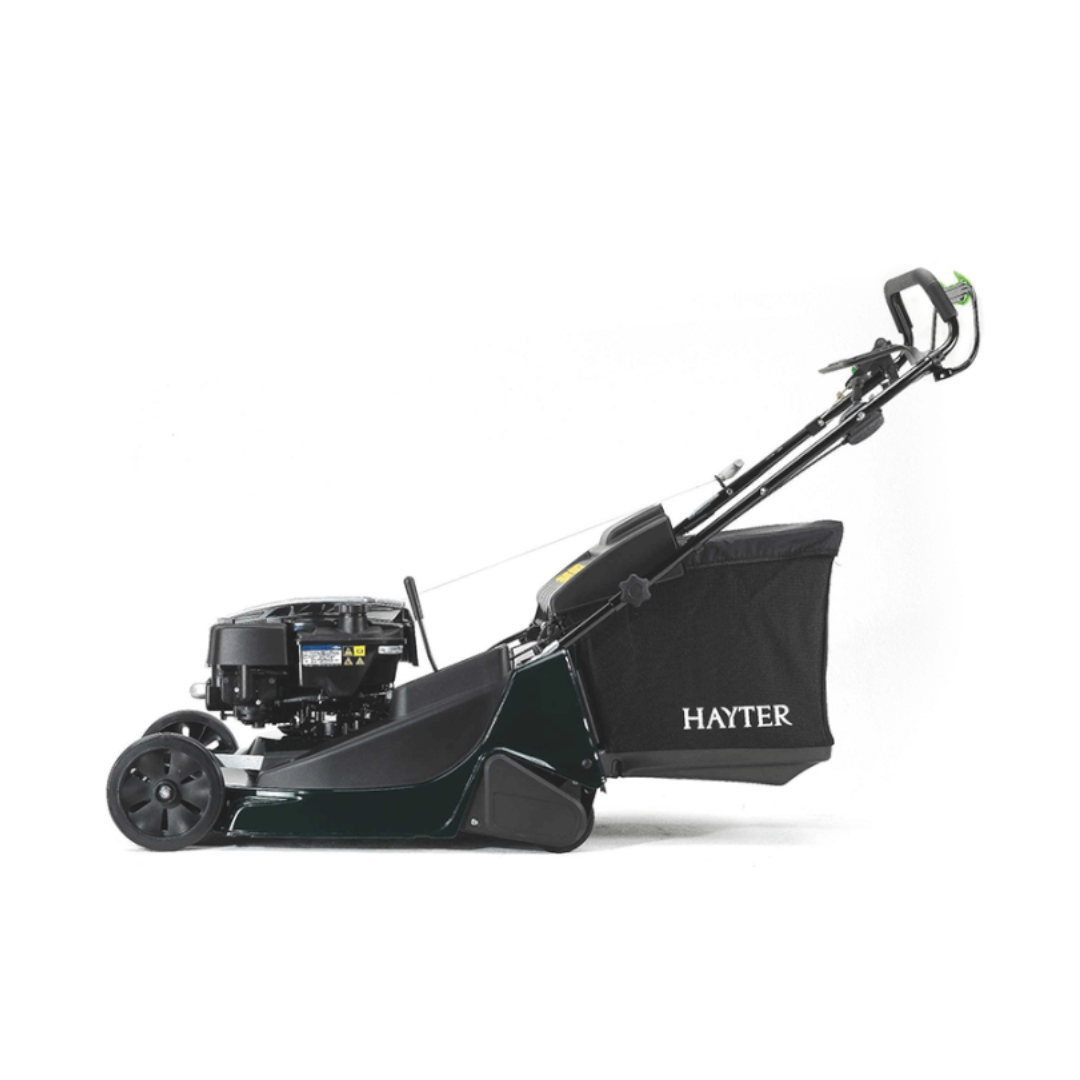 Side profile of the Hayter Harrier 56 BBC System 575A self-propelled petrol lawn mower showing the rear roller, grass collection bag and 56cm cutting deck.