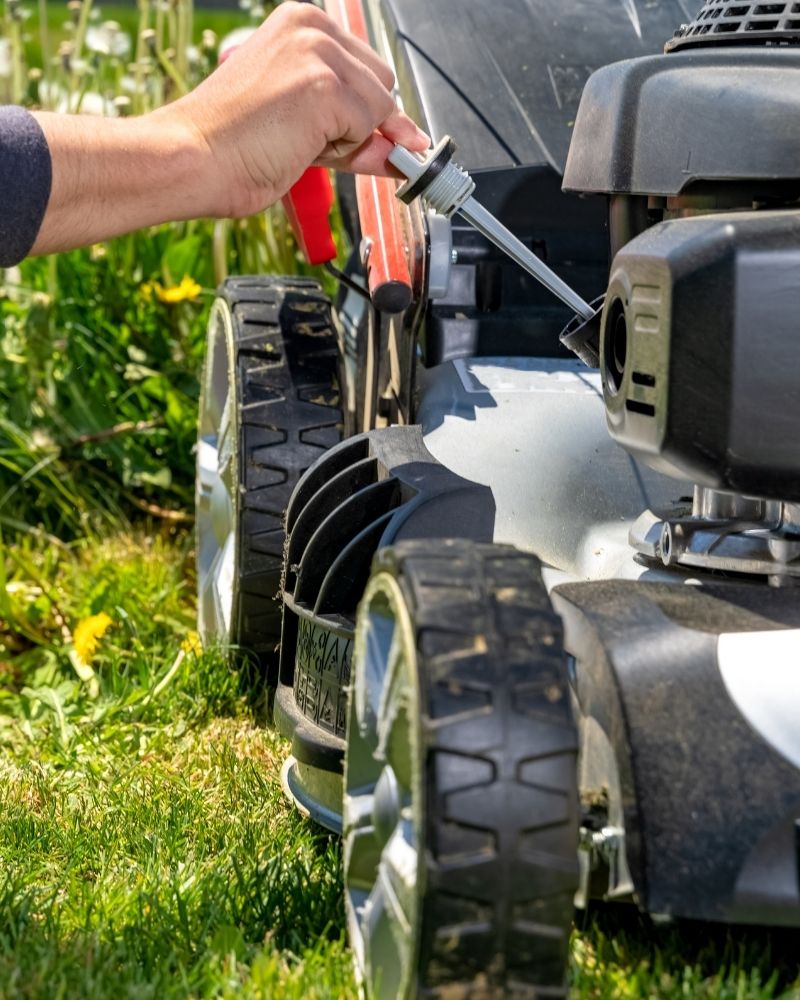 Changing oil in lawn mower